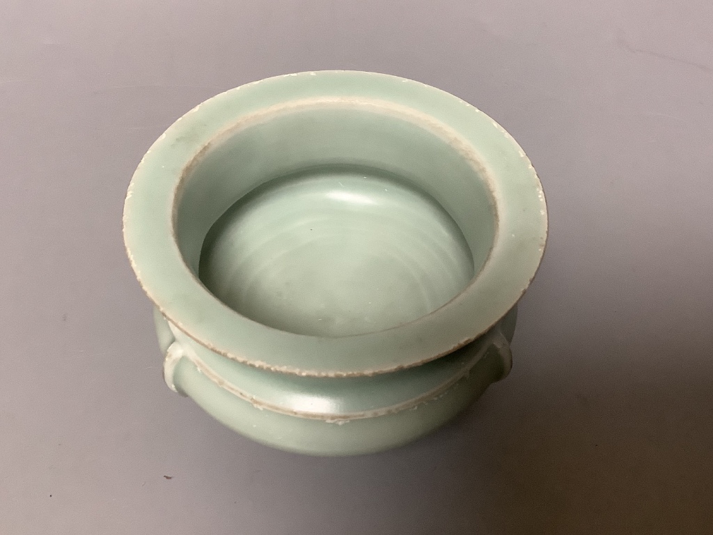 A Chinese celadon glazed tripod censer, diameter 11cm